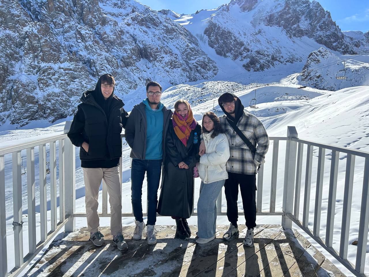 Nikita and Humbleteam colleagues in snowy mountains